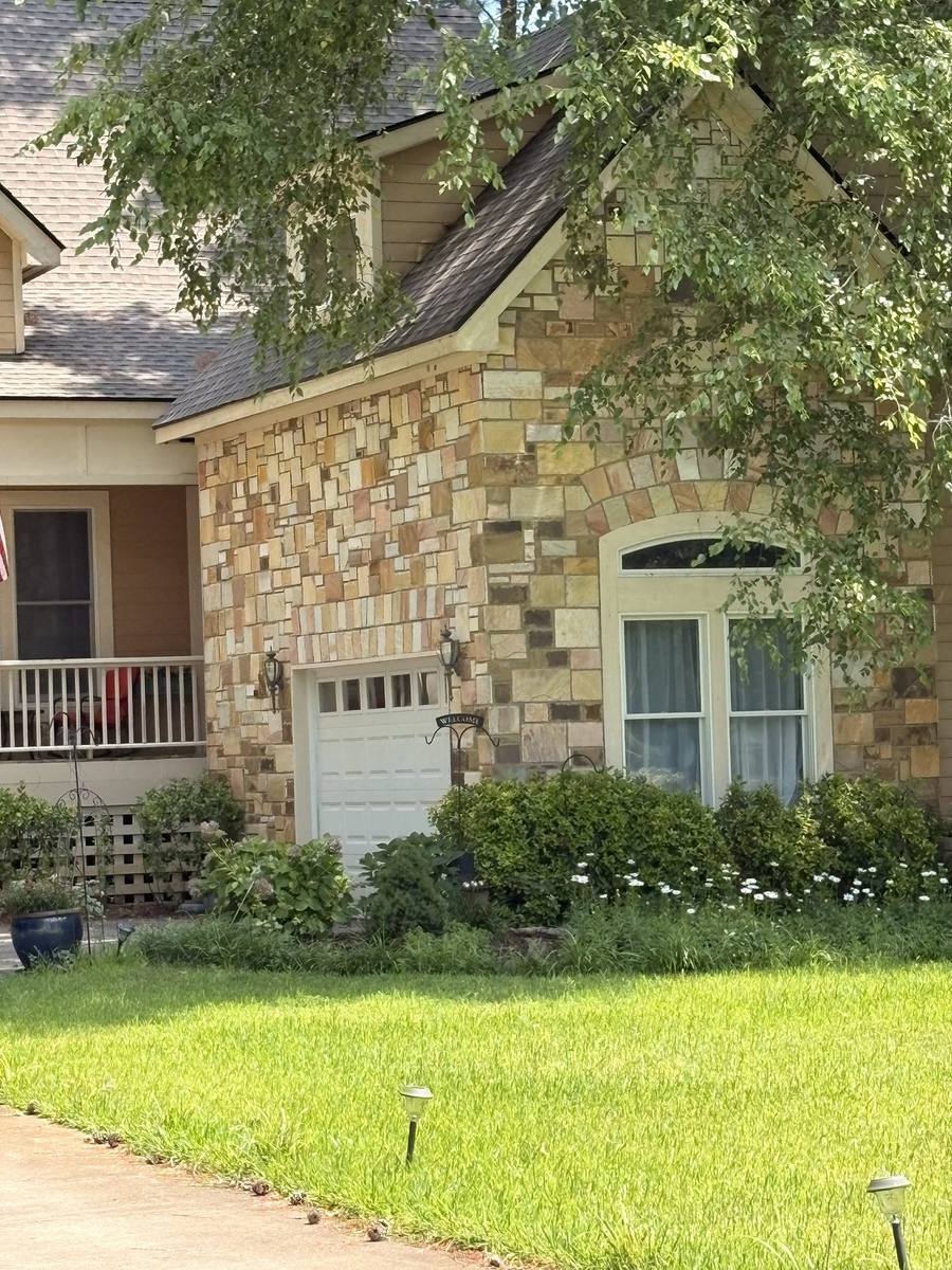Close detail of hand-set natural stone veneer