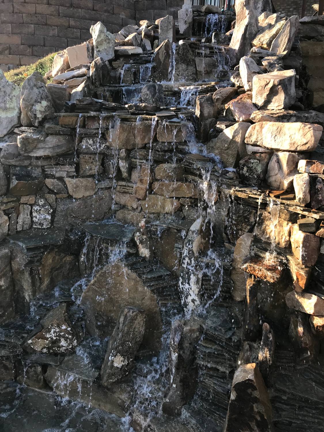 Waterfall stream through planted beds