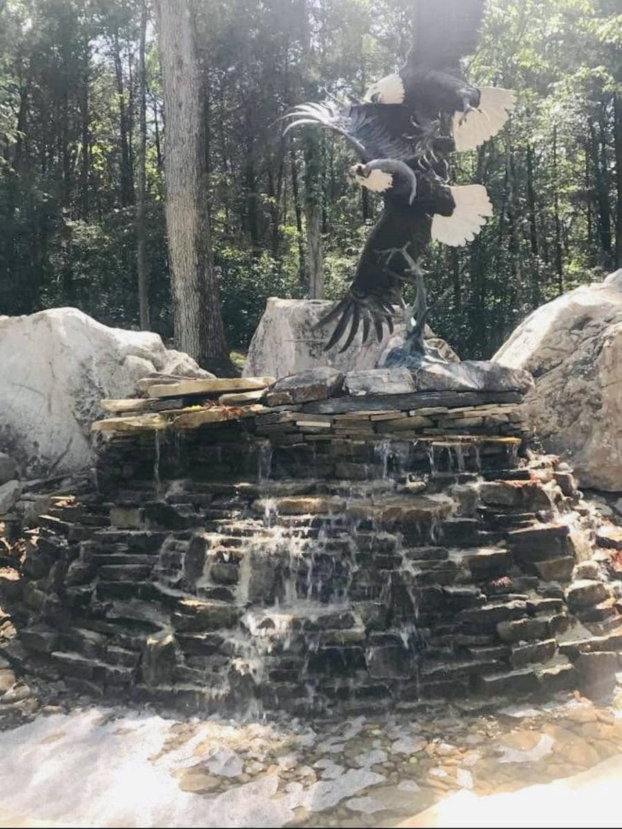 Waterfall fountain with bronze eagle